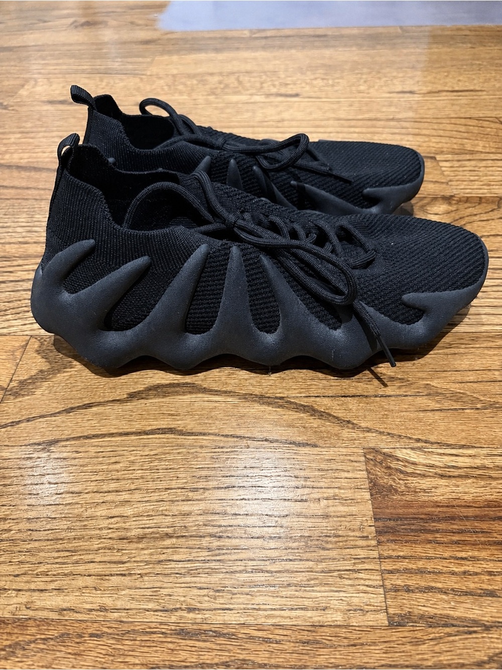 Yeezy Women’s Black Lace-Up Sneakers with Sculpted Wave Sole